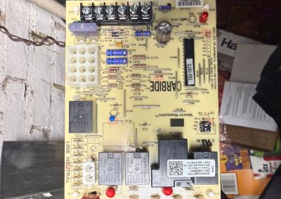 White-Rodgers furnace control circuit board with electronic components and wiring terminals.