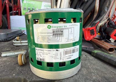 Green Evergreen EM HVAC motor with technical specifications and wiring diagram label.