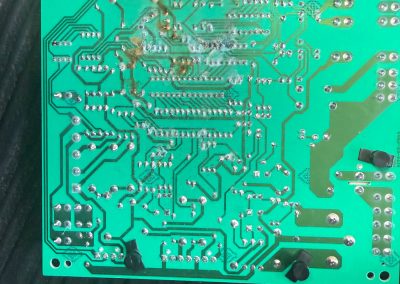 Burnt HVAC control board removed during a repair